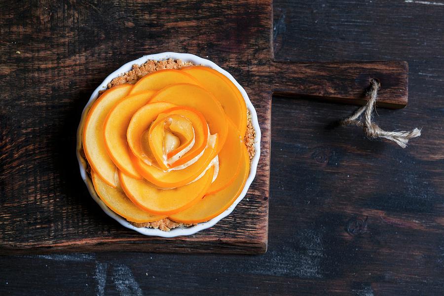 A Rose-shaped Almond Tart With Persimmon Photograph by Susan Brooks-dammann