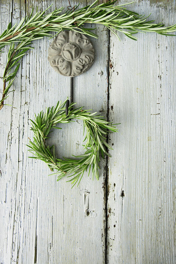 A Rosemary Wreath On A Wooden Wall Photograph by Martina Schindler