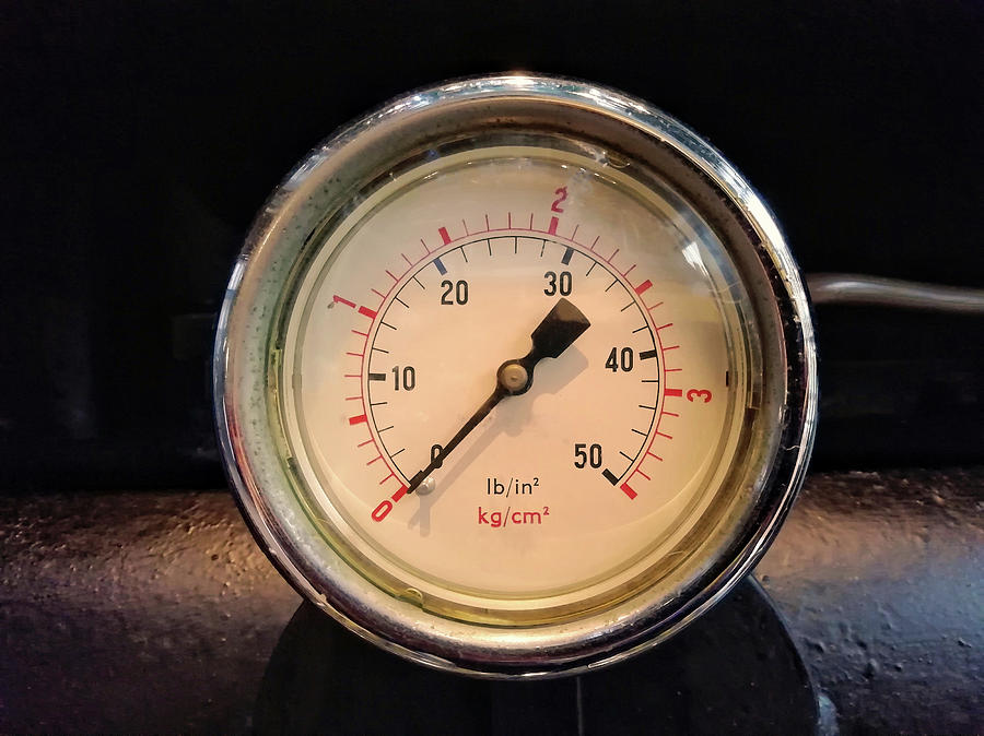 A Round Vintage Industrial Shiny Pressure Gauge With Numbers Marked In Psi And Metr Photograph