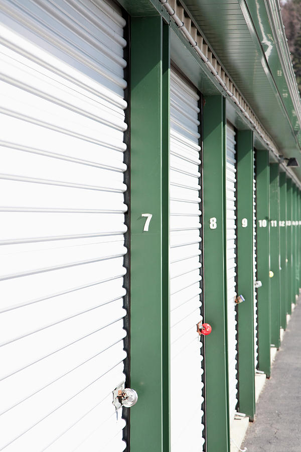 A Row Of Locked Storage Units At A Self Photograph by Frederick Bass