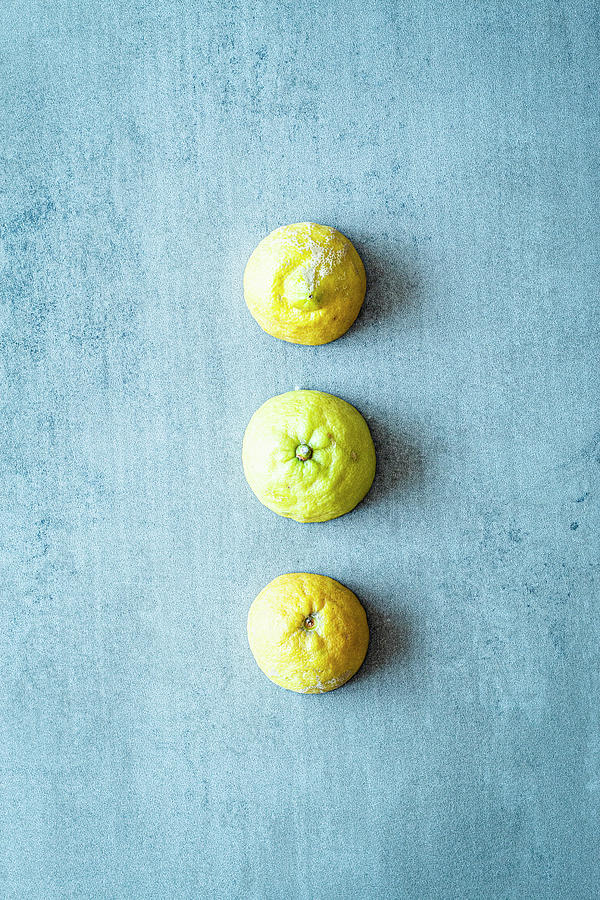 A Row Of Three Halved Lemons Photograph by Simone Neufing