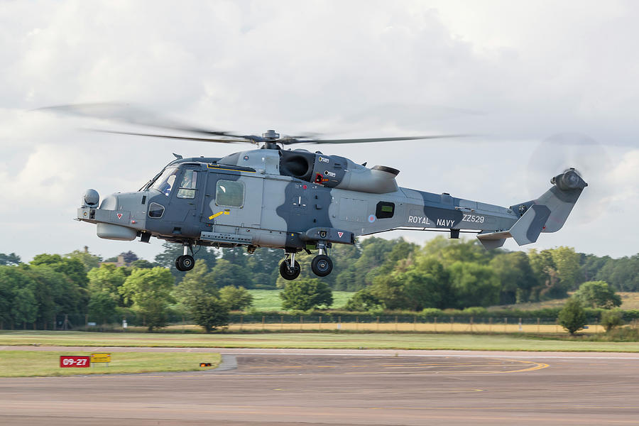 A Royal Navy Wildcat Helicopter Landing Photograph by Rob Edgcumbe