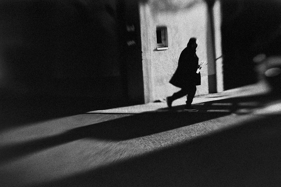 A Running Man With A Newspaper Photograph by Alexander Jikharev