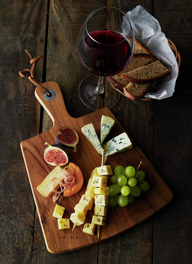 A Rustic Cheese Platter And A Glass Of Red Wine Photograph by Stefan Schulte-ladbeck