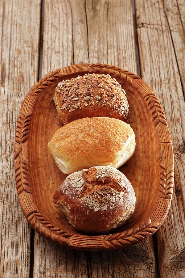 A Rye Bread Roll, A Wheat Bread Roll And A Wholemeal Roll Photograph by Petr Gross