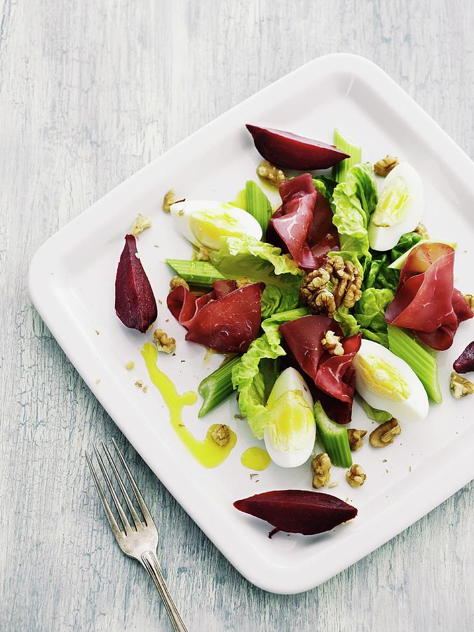 A Salad Of Bresaola, Egg, Walnuts, Celery And Beetroot Photograph by Mikkel Adsbl