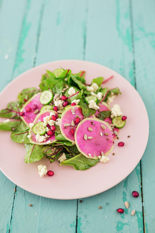 A Salad With Red Chard, Watermelon Radish, Feta Cheese And Pomegranate Seeds Photograph by Jan Wischnewski