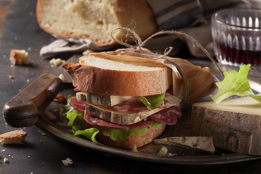 A Salami And Cheese Sandwich Photograph by Blueberrystudio