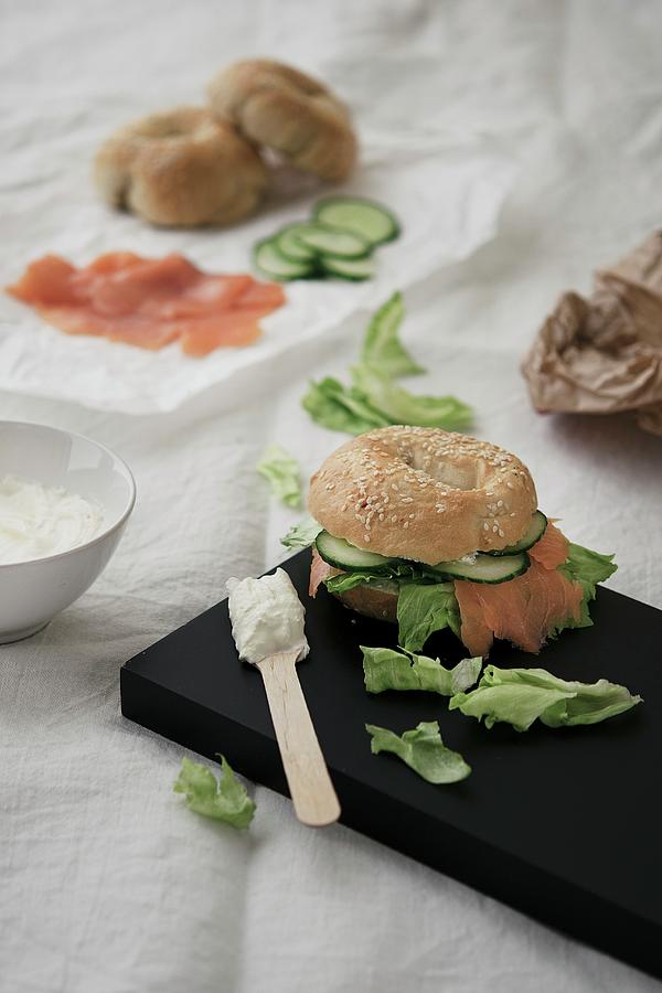 A Salmon Bagel With Cucumber, Lettuce And Cream Cheese Photograph by Justina Ramanauskiene