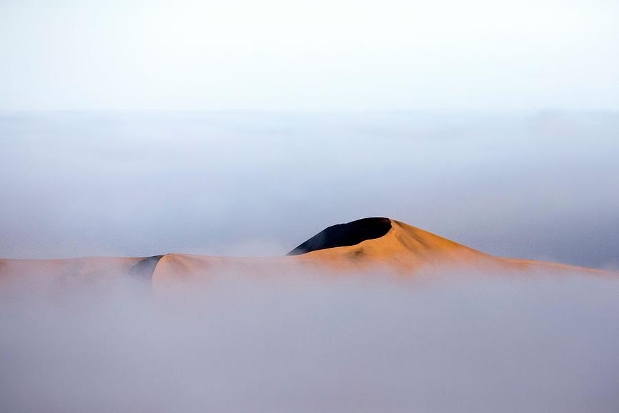 Abstract Photograph - A Sand Dune Rises Above The Fog Line by Ben McRae