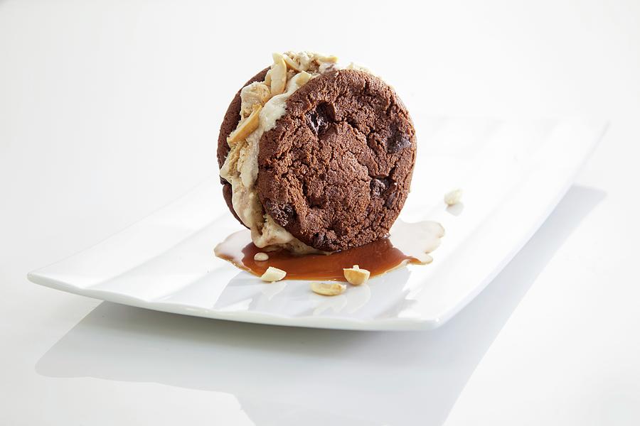 A Sandwich Cookie With Caramel Sauce Photograph by Dan Lev