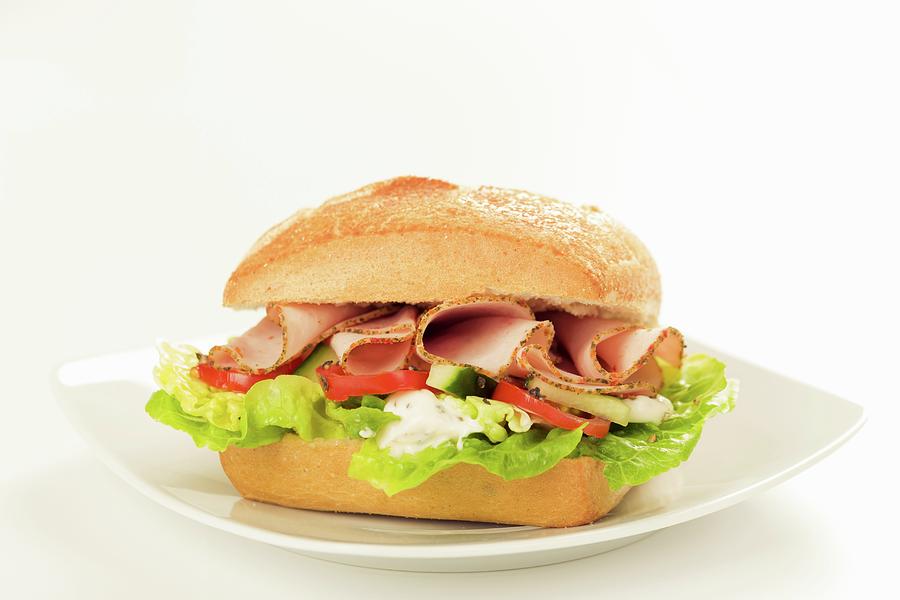 A Sandwich Filled With Lettuce, Tomatoes And Sliced Turkey Photograph by Fischer, Christian