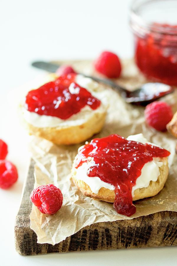 A Scone With Cream And Raspberry Jam Photograph by Nicky Corbishley