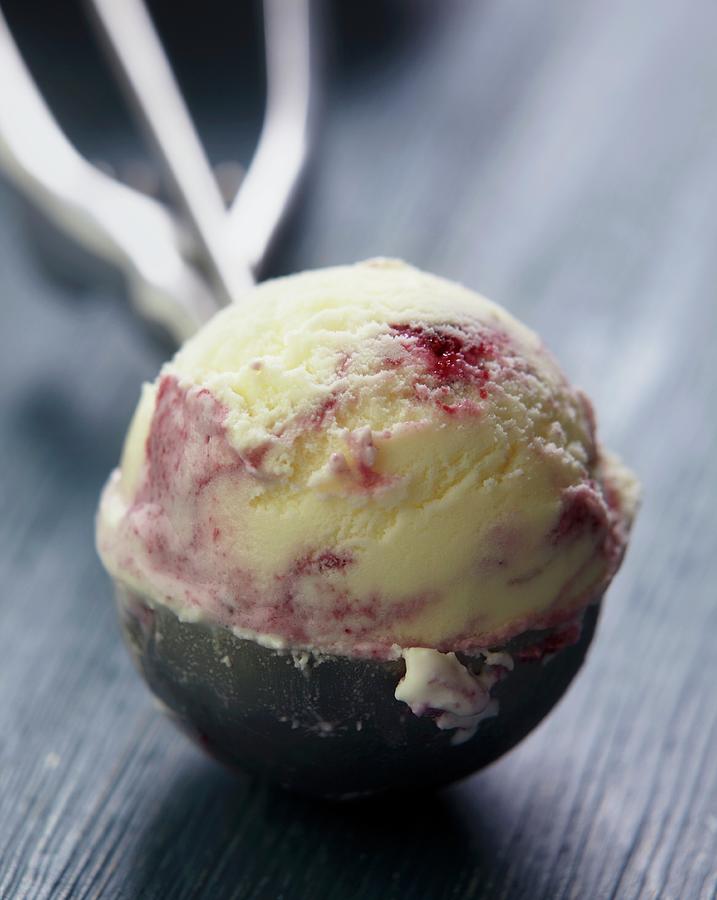 A Scoop Of Blackberry And Blueberry Ice Cream In An Ice Cream Scoop Photograph by Zemgalietis, Maris