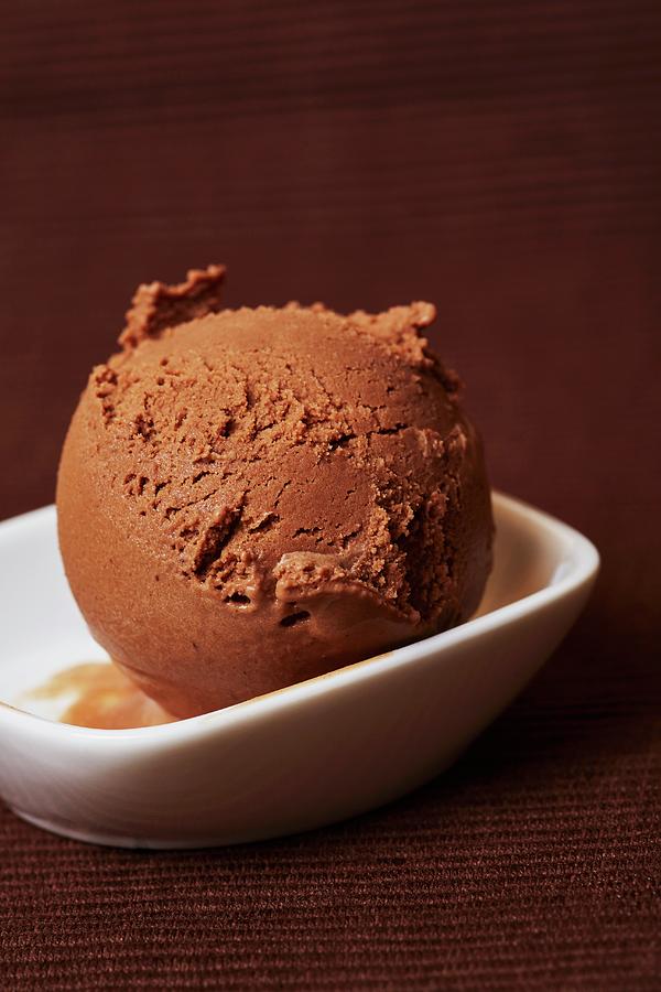 A Scoop Of Chocolate Ice Cream In A Bowl Photograph by Robert Kneschke