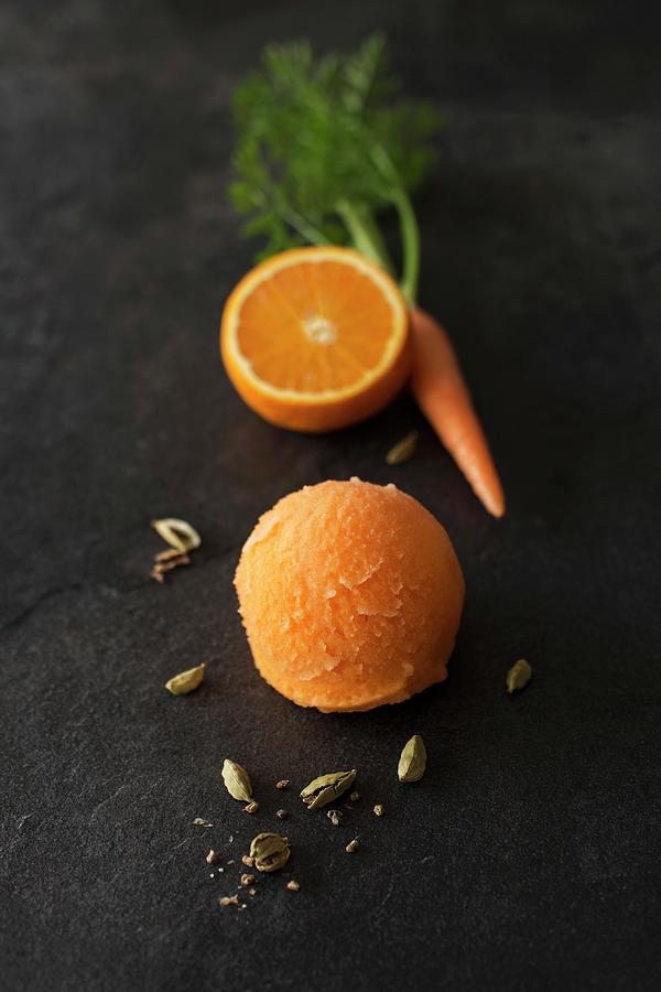 A Scoop Of Orange And Carrot Sorbet Photograph by Jan Wischnewski