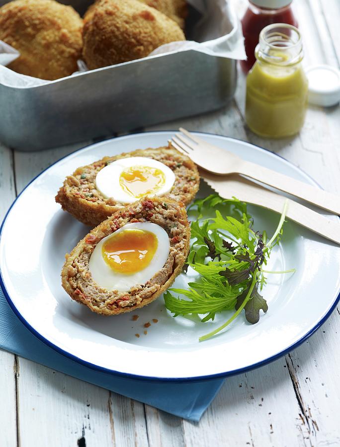 A Scotch Egg With Salad Leaves Photograph by Osborne, Ria - Fine Art ...