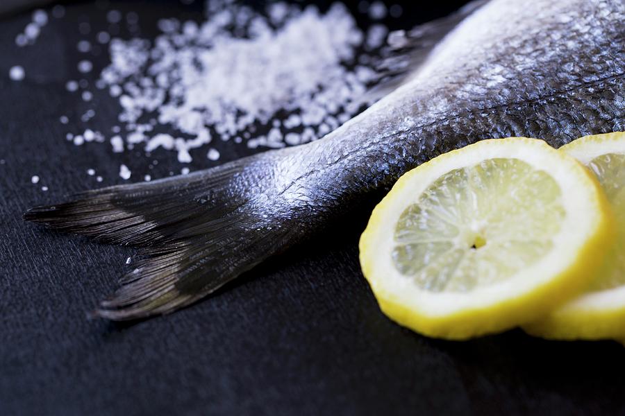 A Seabream Tail With Salt And Lemon Slices ingredients For Seabream In A Salt Crust Photograph by Nicole Godt