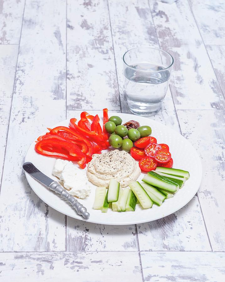 A Selection Of Raw Mediterranean Vegetables With A Dip Photograph by The Studio Collection