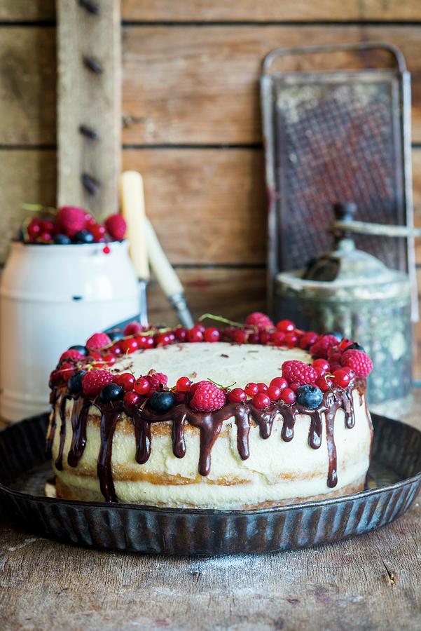 A Semi-naked Cake With Vanilla Cream, Fresh Berries And Chocolate Ganache Photograph by Irina Meliukh
