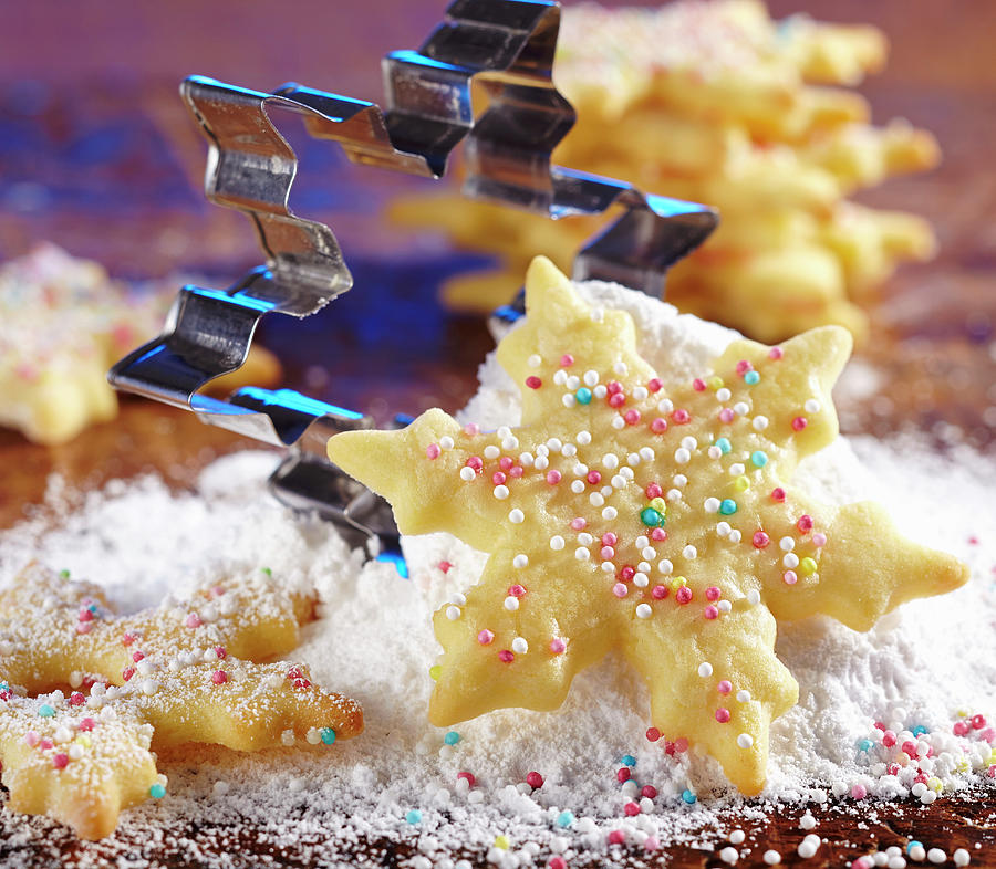 A Shortbread Snowflake Biscuit With Sugar Sprinkles And Icing Sugar Photograph by Teubner Foodfoto