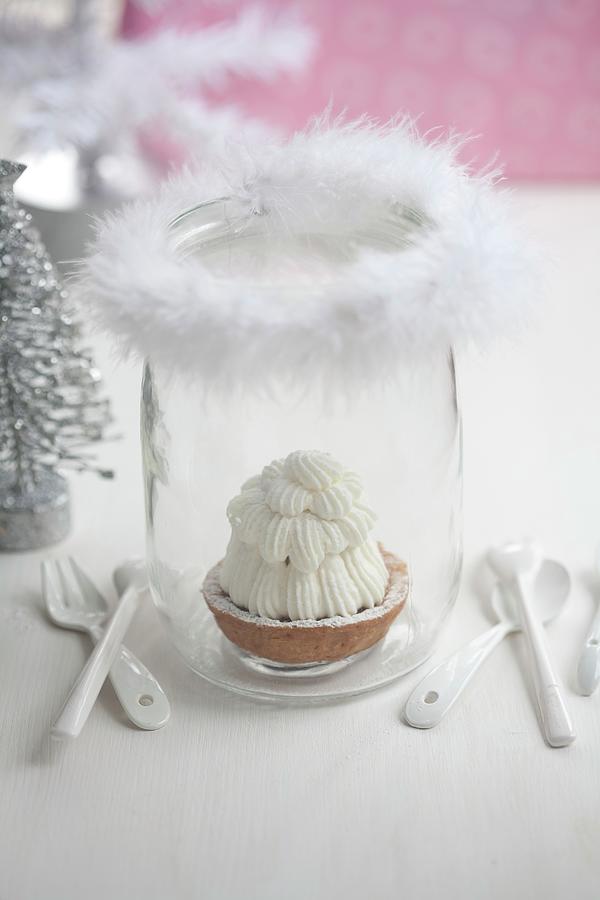 A Shortcrust Tartlet In A Glass Decorated With A Feather Photograph by Martina Schindler