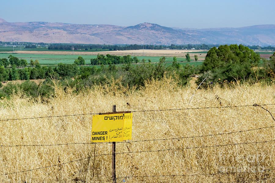 A sign warns of uncleared mines in the Golan Heights, Israel. Photograph by William Kuta