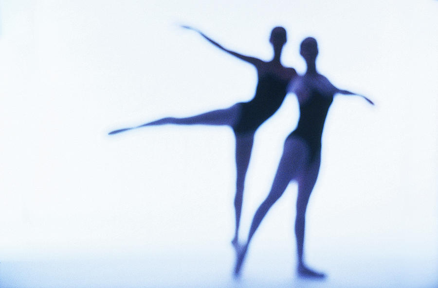 A Silhouette Of Two Young Women Photograph by George Doyle