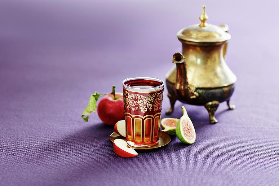 A Silver Teapot And A Glass Of Turkish Apple Tea Photograph by Thorsten Kleine Holthaus