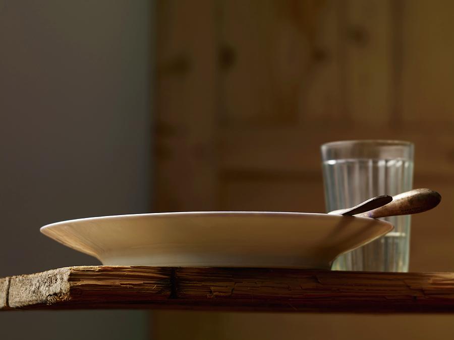 A Simple Place Setting On A Rustic Wooden Table Photograph by Studio R. Schmitz