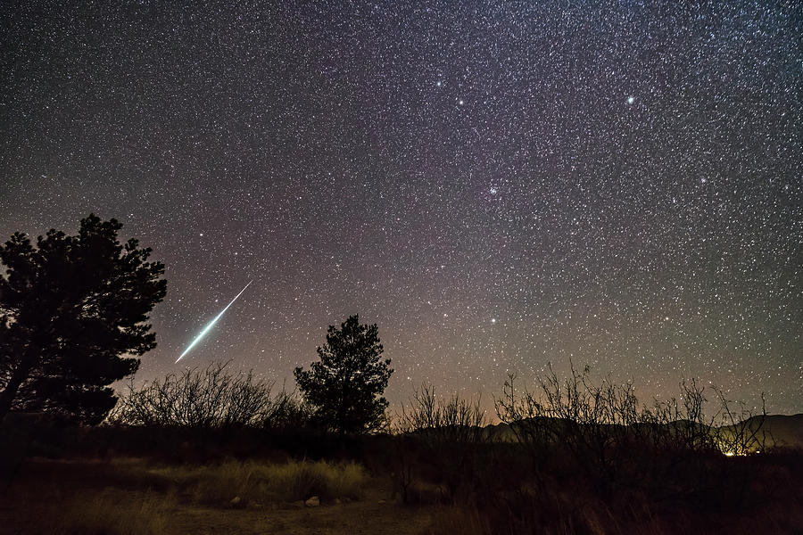 A Single Bright Meteor From The Geminid Photograph by Alan Dyer
