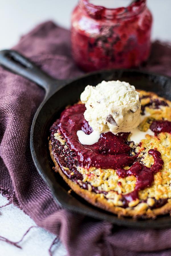 A Skillet Cookie With Jam And Vanilla Ice Cream Photograph by Hein Van Tonder