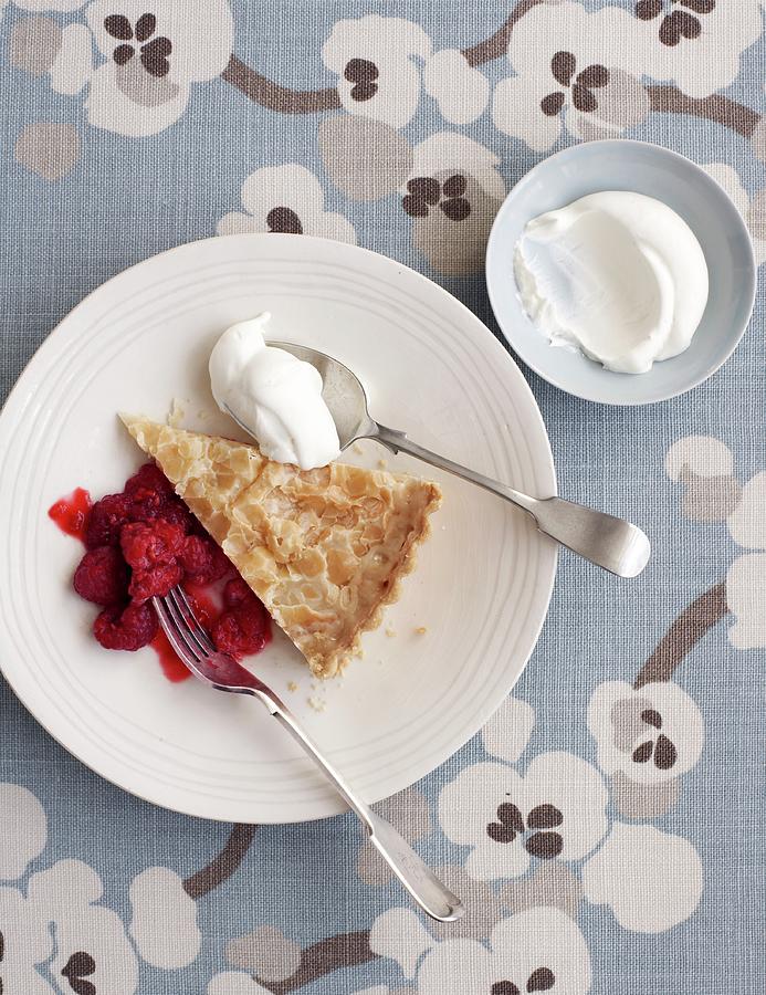 A Slice Of Almond Tart With Raspberry Compote And Cream Photograph by Jonathan Gregson