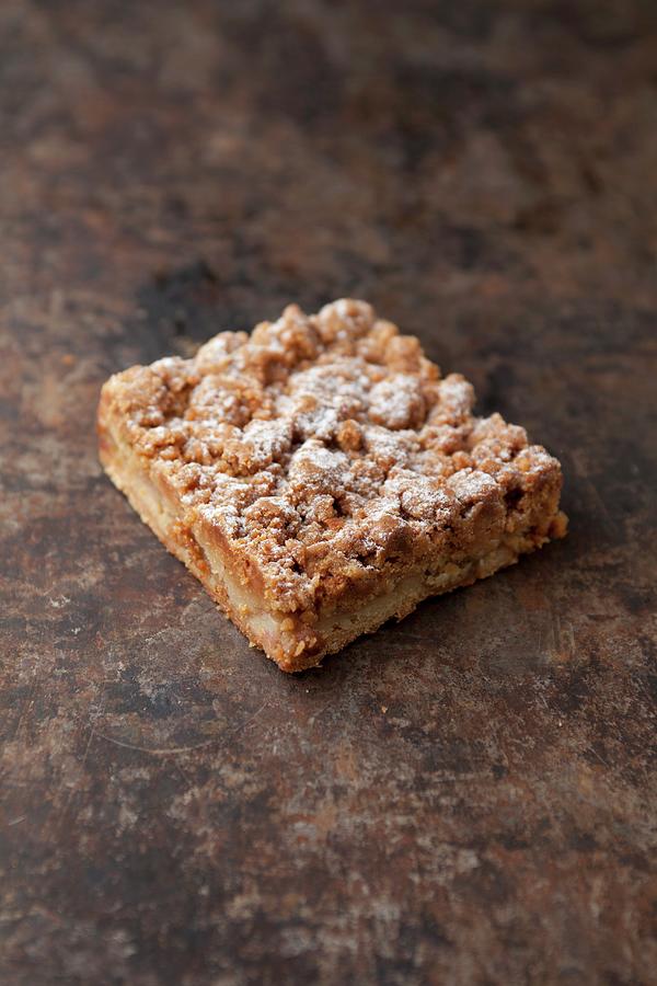 A Slice Of Apple Crumble Cake On A Baking Tray Photograph by Joerg Lehmann