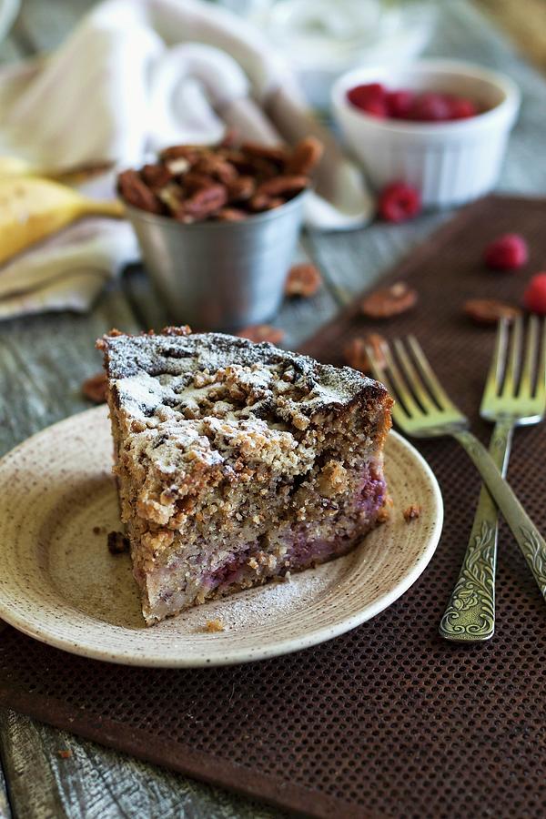 A Slice Of Banana Cake With Raspberries And Pecan Nuts Photograph by Malgorzata Laniak
