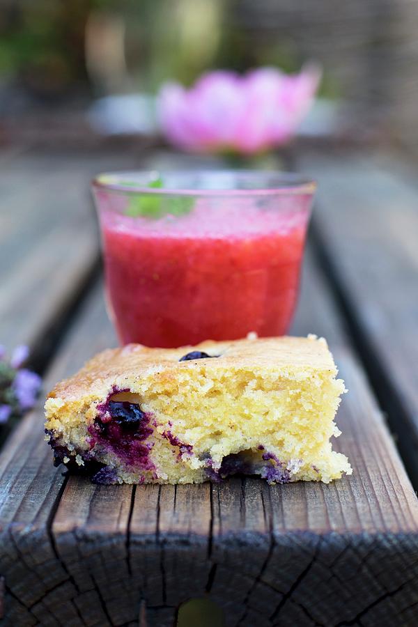 A Slice Of Berry Cake And A Strawberry Drink On A Wooden Table Photograph by Agnes Swart