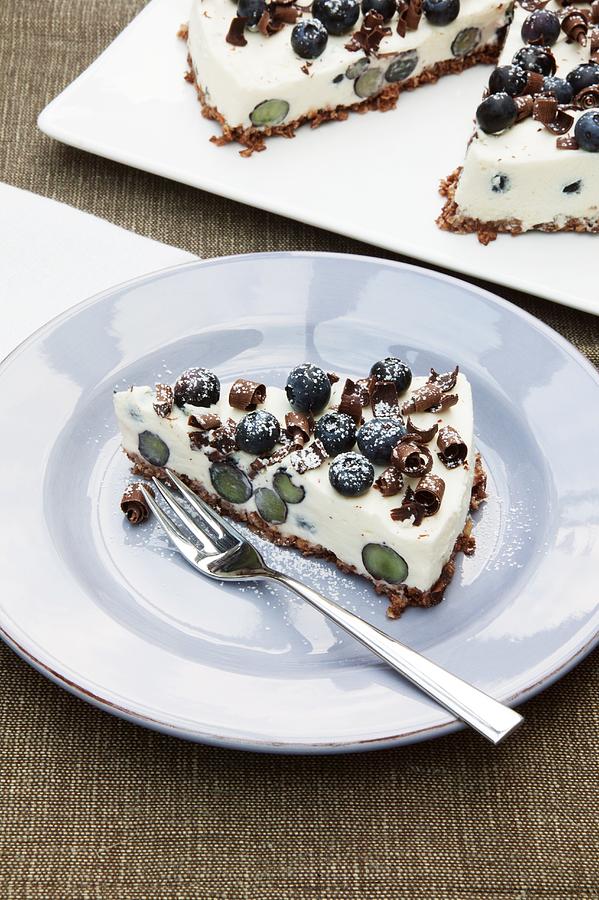 A Slice Of Blueberry Cheesecake With A Muesli Base Photograph by Food Experts Group