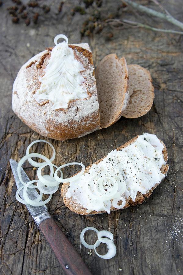 A Slice Of Bread And Dripping With Onion Rings In Front Of A Sliced