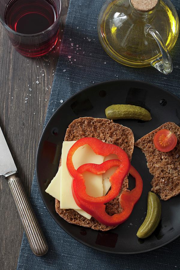 A Slice Of Bread Topped With Cheese And Peppers, With Gherkins Photograph by Miltsova, Olga