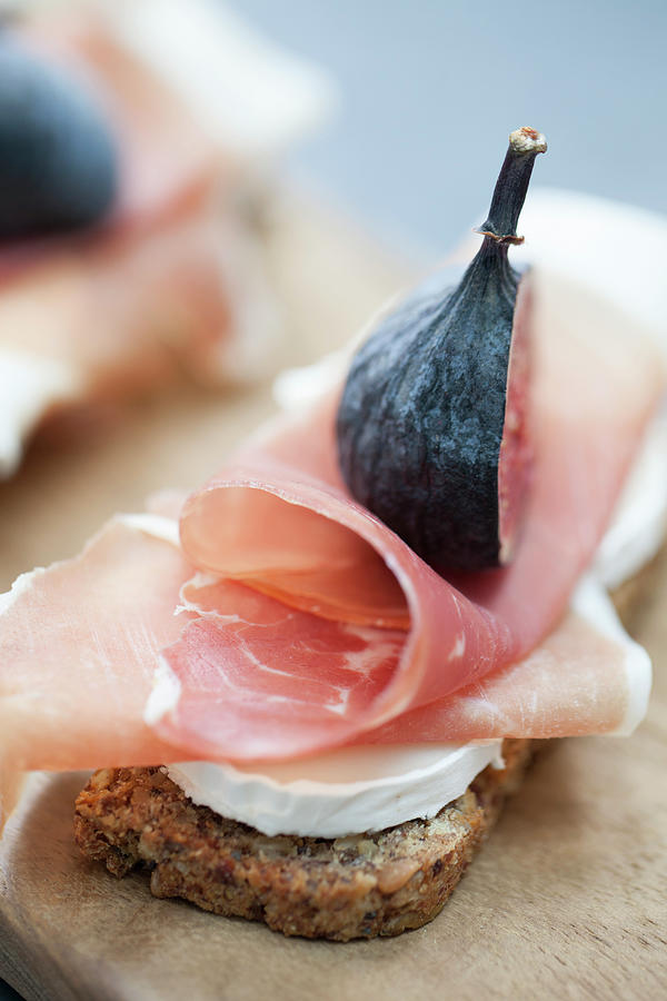 A Slice Of Bread Topped With Goats Cheese, Parma Ham And Fig Photograph by Kathrin Mccrea