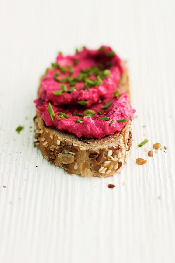 A Slice Of Bread With Beetroot Cream Cheese Photograph by Michael Wissing