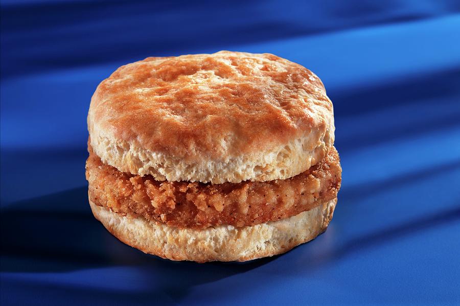 A Slice Of Breaded Sausage In An American Biscuit Photograph by Colin Cooke