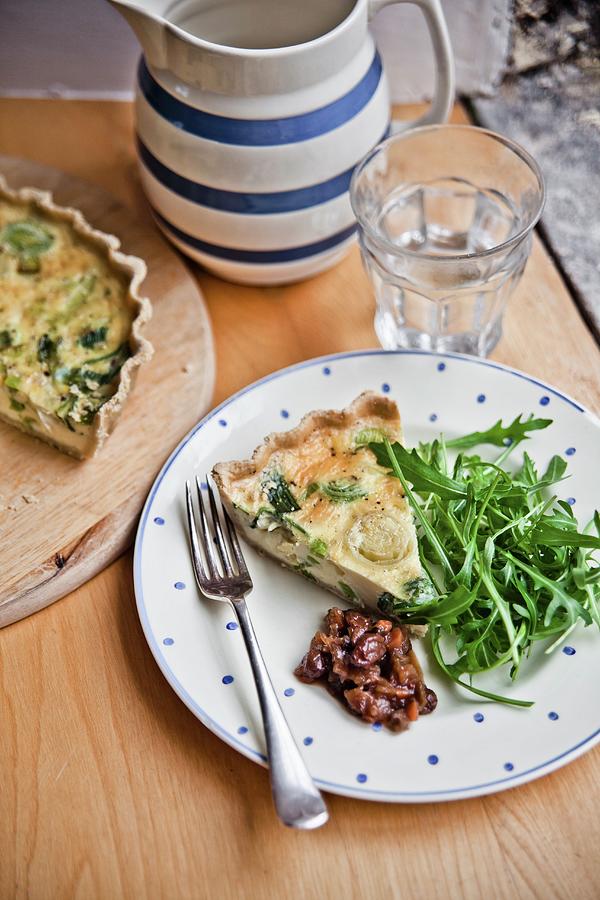 A Slice Of Cheddar And Leek Quiche With Rocket And Apple Chutney Photograph by George Blomfield