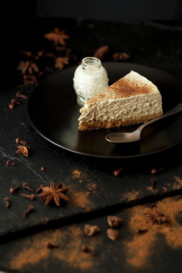 A Slice Of Cheesecake With Star Anise, Cinnamon And Cloves Photograph by Jane Saunders