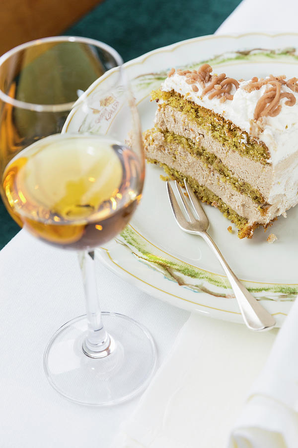 A Slice Of Chestnut Cake With A Glass Of Dessert Wine Photograph by Anneliese Kompatscher