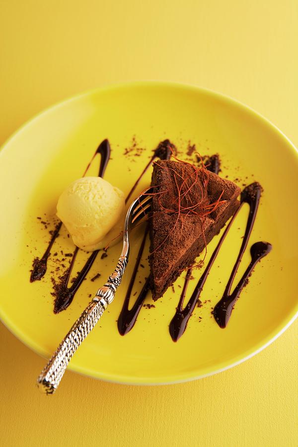 A Slice Of Chocolate Mousse Cake With Pumpkin Ice Cream Photograph by Michael Wissing