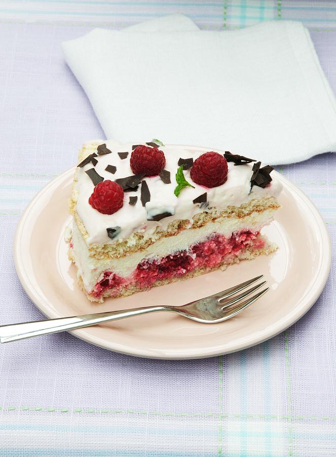 A Slice Of Cream Cheese Layer Cake With Raspberries Photograph by Food Experts Group