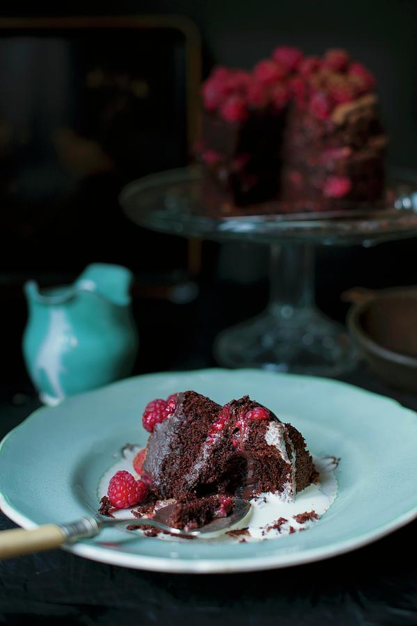 A Slice Of Dark Chocolate And Raspberry Cake With A Bite Taken Out Photograph by Magdalena Hendey