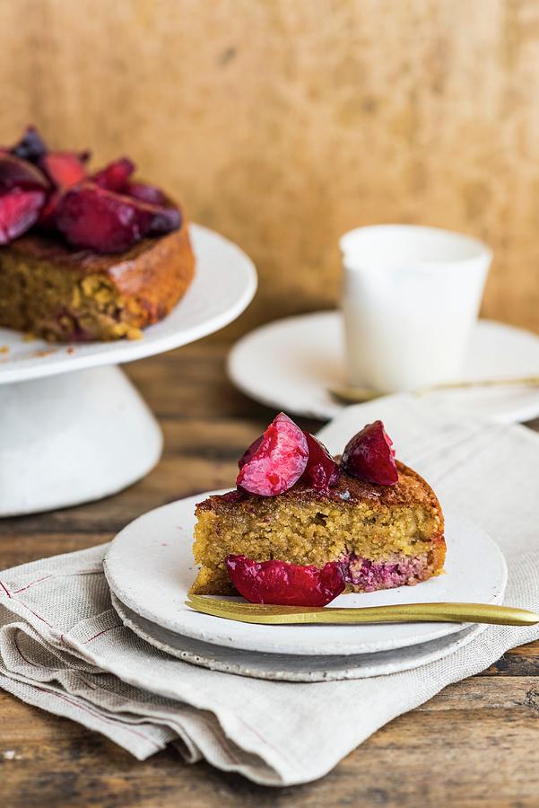A Slice Of Hazelnut And Plum Cake Photograph by Hein Van Tonder