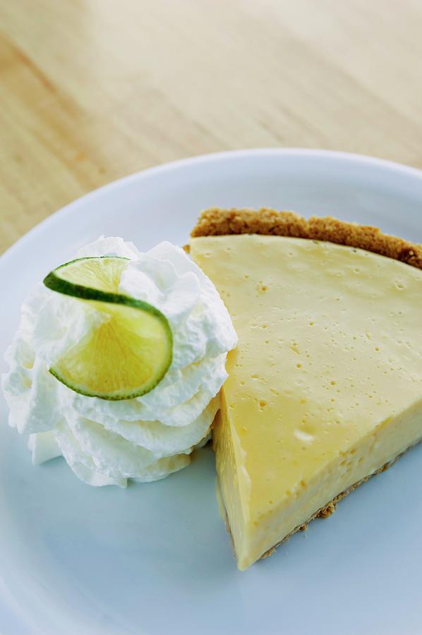 Fruit Photograph - A Slice Of Key Lime Pie With Whipped Cream by Rank, Erik